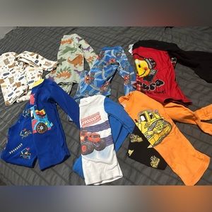 7 pairs of 5T pajamas. Different brands.